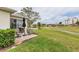 Spacious backyard with brick patio overlooking a pond and a golf course at 1714 Fairway Trce, Palmetto, FL 34221