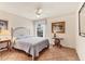 Cozy bedroom featuring tiled floors, a ceiling fan and a window overlooking the neighborhood at 1714 Fairway Trce, Palmetto, FL 34221