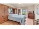 Bright bedroom with a built in wardrobe and views to the backyard at 1714 Fairway Trce, Palmetto, FL 34221