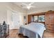 Bedroom featuring a built in wardrobe, dresser, and large window at 1714 Fairway Trce, Palmetto, FL 34221