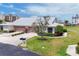 Well-maintained home boasts a two-car garage, lush landscaping, and pristine curb appeal in a desirable location at 1714 Fairway Trce, Palmetto, FL 34221