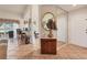 Inviting foyer with tile flooring, a mirrored wall, and decorative accents, leading into the living spaces at 1714 Fairway Trce, Palmetto, FL 34221