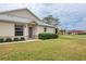Inviting front exterior featuring a neatly landscaped lawn and charming entrance, offering a welcoming curb appeal at 1714 Fairway Trce, Palmetto, FL 34221