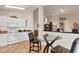 Eat in kitchen nook with views to the living room and tiled floors at 1714 Fairway Trce, Palmetto, FL 34221