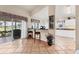 Modern kitchen featuring sleek cabinetry, bar seating, and abundant natural light, offering both style and functionality at 1714 Fairway Trce, Palmetto, FL 34221