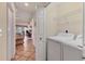 Bright laundry room with washer, dryer, and access to the living room at 1714 Fairway Trce, Palmetto, FL 34221