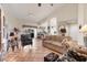 Comfortable living room featuring tile floors, neutral tones, and a sliding glass door, perfect for relaxation at 1714 Fairway Trce, Palmetto, FL 34221