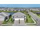 Panoramic aerial view of a community with lake views, modern houses, and beautiful landscaping at 17902 Cherished Loop, Lakewood Ranch, FL 34211