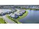 Expansive aerial view of a well-planned community with lakefront homes and lush landscaping at 17902 Cherished Loop, Lakewood Ranch, FL 34211