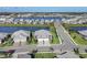 Expansive aerial shot of a lakeside neighborhood with serene water views and stylish residences at 17902 Cherished Loop, Lakewood Ranch, FL 34211