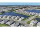 Stunning aerial view of a lakeside community with well-planned streets and modern homes at 17902 Cherished Loop, Lakewood Ranch, FL 34211