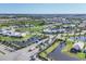 An aerial view of a meticulously planned community with palm-lined streets and recreational amenities at 17902 Cherished Loop, Lakewood Ranch, FL 34211