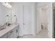 Modern bathroom with marble floors, a white vanity, and a glass-enclosed shower at 17902 Cherished Loop, Lakewood Ranch, FL 34211