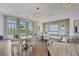 Bright café area with a variety of seating options and elegant chandeliers for a relaxing atmosphere at 17902 Cherished Loop, Lakewood Ranch, FL 34211