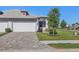 Attractive single-story home showcasing a two-car garage and well-maintained landscaping at 17902 Cherished Loop, Lakewood Ranch, FL 34211