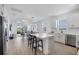 Open kitchen featuring an island with bar seating and views of the living room at 17902 Cherished Loop, Lakewood Ranch, FL 34211