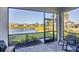 Enjoy the lanai overlooking a pond, screened-in for comfortable outdoor living and serene views at 17902 Cherished Loop, Lakewood Ranch, FL 34211