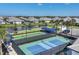 Community pickleball courts with lake view, providing recreational opportunities at 17902 Cherished Loop, Lakewood Ranch, FL 34211
