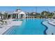Resort-style pool with sun loungers and a covered pavilion offers a relaxing oasis for residents to enjoy at 17902 Cherished Loop, Lakewood Ranch, FL 34211