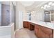 Bathroom features double sinks, walk-in shower, and tile flooring for a clean and functional space at 1806 85Th Nw Ct, Bradenton, FL 34209