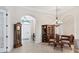 Elegant dining room showcases archways, a chandelier, and stylish furniture at 1806 85Th Nw Ct, Bradenton, FL 34209