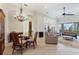 Open-concept living and dining areas with tiled floors offer a great flow for entertaining and Gathering gatherings at 1806 85Th Nw Ct, Bradenton, FL 34209