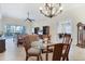 Spacious open-concept living space with tiled floors seamlessly connects the living, dining, and study areas at 1806 85Th Nw Ct, Bradenton, FL 34209