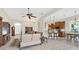 Open-concept living room with tiled floors seamlessly integrates kitchen and dining areas, providing an inviting space at 1806 85Th Nw Ct, Bradenton, FL 34209