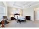 Comfortable bedroom boasts a ceiling fan, a cozy chair, and ample space for relaxation and rest at 1806 85Th Nw Ct, Bradenton, FL 34209