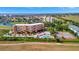 Scenic aerial view of condo community with pool, tennis courts, and waterfront access at 2311 14Th W Ave # 208, Palmetto, FL 34221