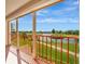 Balcony view of a tranquil pond with a gazebo, walking path and picturesque landscaping at 2311 14Th W Ave # 208, Palmetto, FL 34221