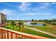 Balcony view featuring a lake, golf course, and lush greenery, enhancing the appeal of the community at 2311 14Th W Ave # 208, Palmetto, FL 34221
