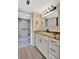 Updated bathroom with granite counters, white vanity, and walk-in shower at 2311 14Th W Ave # 208, Palmetto, FL 34221