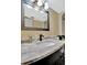Close up of marble vanity in bathroom with modern fixture and decorative framed mirror at 2311 14Th W Ave # 208, Palmetto, FL 34221