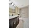 Bathroom with a modern vanity with bronze fixtures and a shower-tub combo with seat at 2311 14Th W Ave # 208, Palmetto, FL 34221
