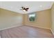 Bedroom with ceiling fan and light walls at 2311 14Th W Ave # 208, Palmetto, FL 34221