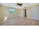 Well-lit bedroom featuring a ceiling fan, light-colored walls, and a closet at 2311 14Th W Ave # 208, Palmetto, FL 34221
