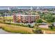 Beautiful condominium building with a pool and tennis court in a lush, green community at 2311 14Th W Ave # 208, Palmetto, FL 34221