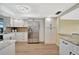 Updated kitchen featuring white cabinets, stainless steel appliances, and granite countertops at 2311 14Th W Ave # 208, Palmetto, FL 34221