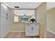 Bright kitchen area with granite countertops and open view to the living room at 2311 14Th W Ave # 208, Palmetto, FL 34221