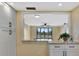 Bright kitchen area with granite countertops and open view to the living room at 2311 14Th W Ave # 208, Palmetto, FL 34221