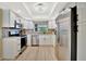 Modern kitchen with stainless steel appliances, white cabinets, and granite countertops at 2311 14Th W Ave # 208, Palmetto, FL 34221
