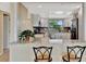 Open concept, updated kitchen offers bar seating and views to the outdoors at 2311 14Th W Ave # 208, Palmetto, FL 34221