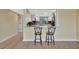 Bright kitchen featuring granite countertops, breakfast bar, and stainless steel appliances at 2311 14Th W Ave # 208, Palmetto, FL 34221