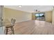 Open living room with sliding glass doors leading to the balcony with scenic water views at 2311 14Th W Ave # 208, Palmetto, FL 34221