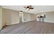 Large living room with ceiling fan, access to the kitchen and outdoor views from the sliding door at 2311 14Th W Ave # 208, Palmetto, FL 34221
