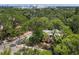 Beautiful aerial view of the home tucked away amongst a lovely canopy of trees at 2315 Mcclellan Pkwy, Sarasota, FL 34239