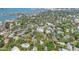 Coastal neighborhood aerial view with lush trees and beautiful Sarasota bay in the background at 2315 Mcclellan Pkwy, Sarasota, FL 34239