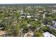 A scenic aerial view of a neighborhood with lush greenery and beautiful homes at 2315 Mcclellan Pkwy, Sarasota, FL 34239