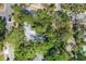 Aerial view showcasing the property's location among mature trees and community streets at 2315 Mcclellan Pkwy, Sarasota, FL 34239